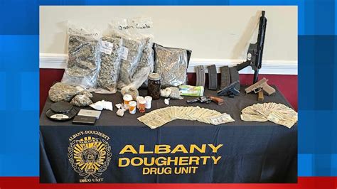 Search warrant yields firearms and drugs in Albany